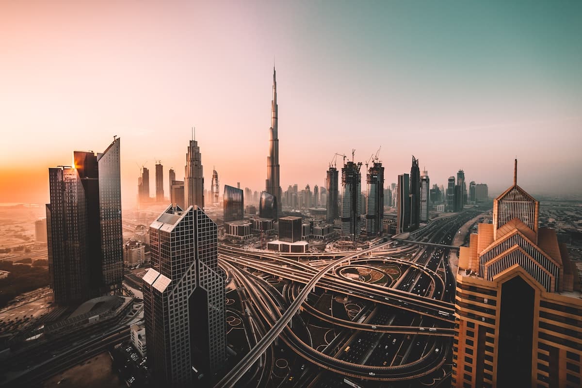 The Dubai skyline at sunrise seen from above